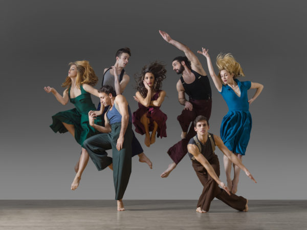 A group of dancers leap