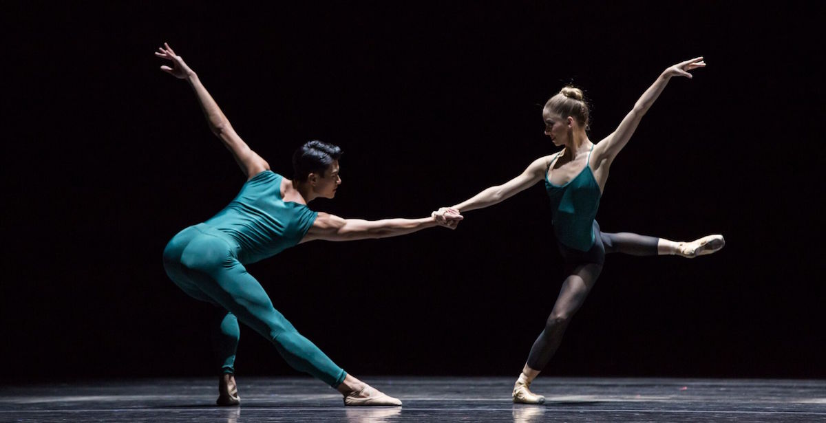 Two dancers facing each other