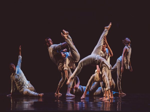 Dancers against a dark backdrop
