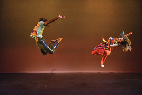 Two dancers jumping