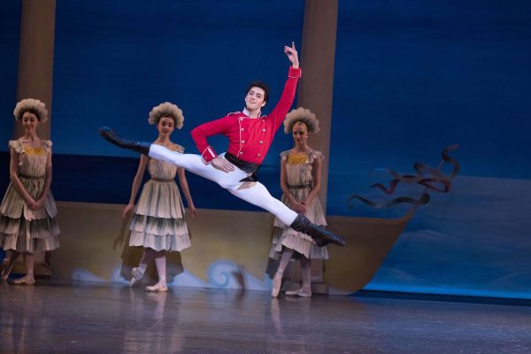 A dancer leaps in the air in The Nutcracker