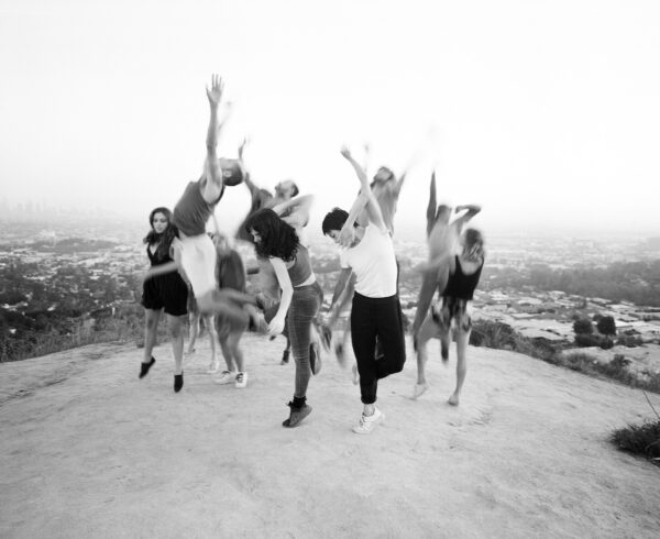Dancers leaping outdoors