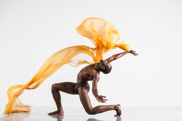 A dance with a yellow scarf