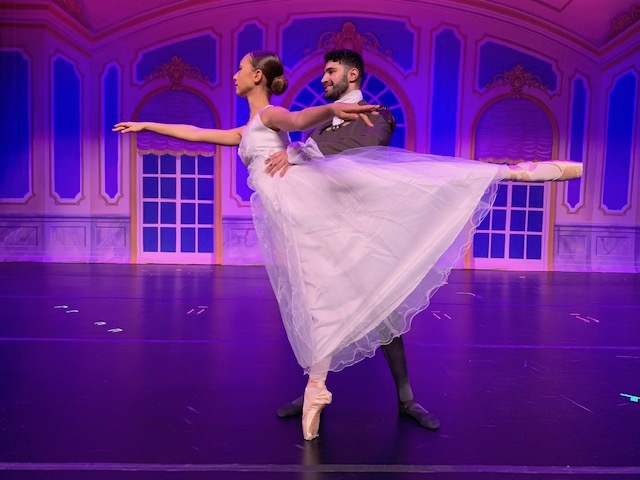 A dancer in arabesque supported by her partner