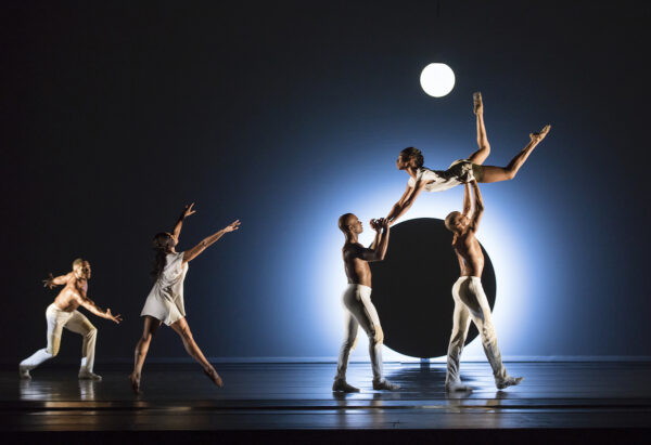 Dancers lift another dancer