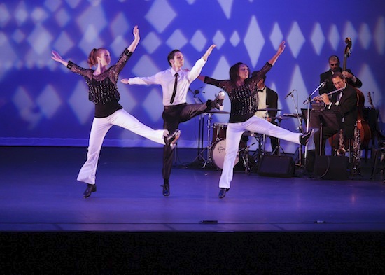 Three dancers tap onstage