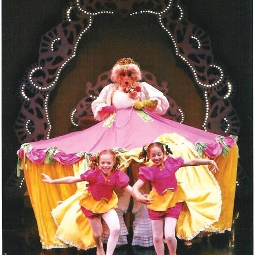 Kids pop out of a large skirt