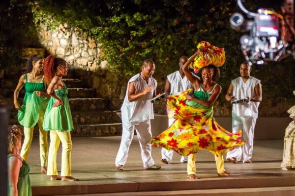 Dancer in yellow skirt with headdress