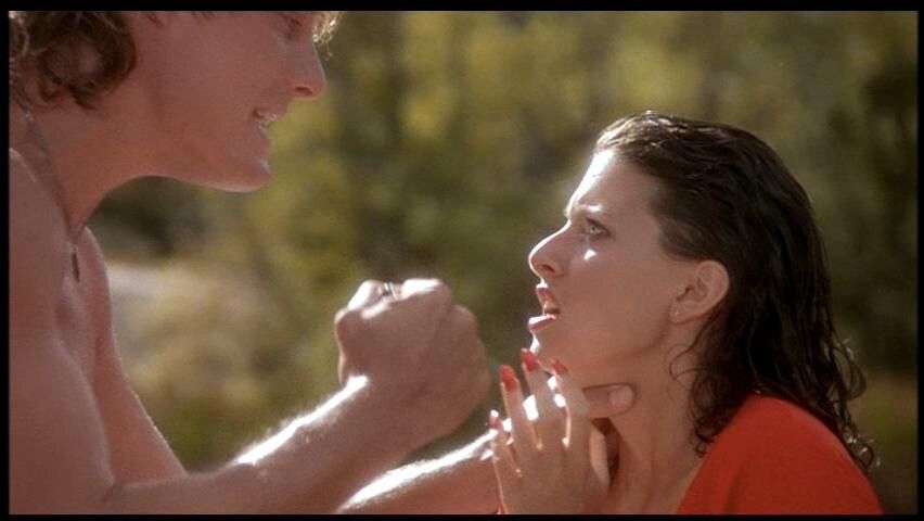 a white man without a shirt threatens to punch a white woman in a red shirt.