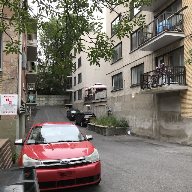 shows how shared looping driveway can express a sense of community between occupants of neighbouring buildings