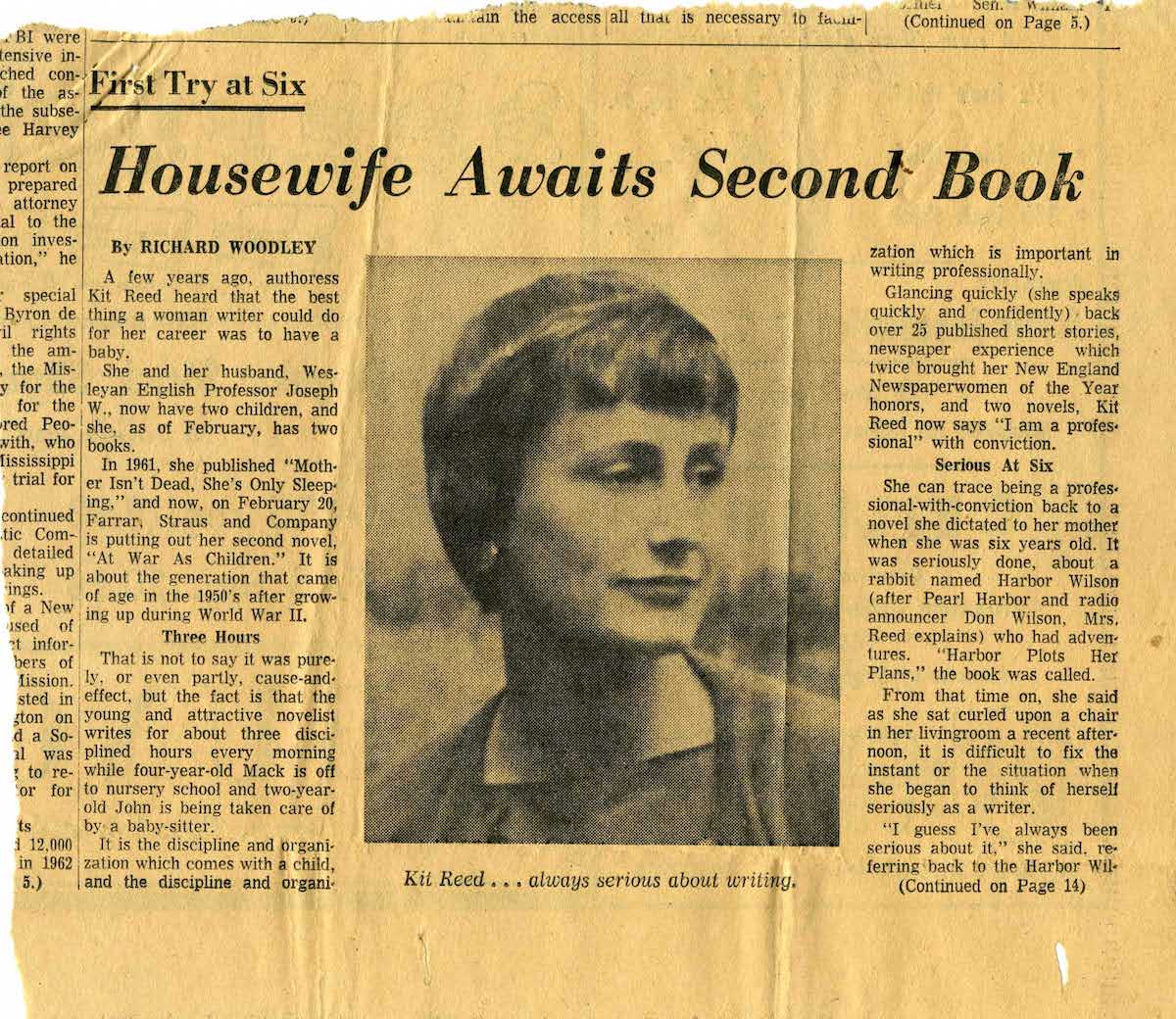 A yellowed newspaper clipping with the headline Housewife Awaits Second Book above a black and white photo of a short haired woman named Kit Reed.