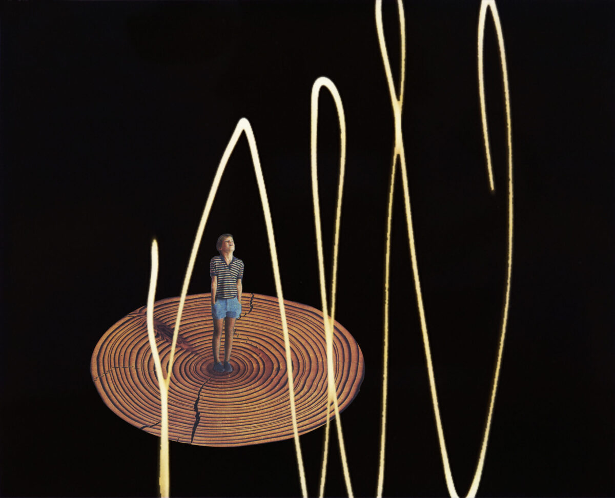 A little boy with his hands in the pockets of his shorts stands at the center of the cross section of a giant tree, which reveals it's advanced age. Verticle white line scribbles are in front of him and behind him a black background.