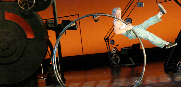 A man in a metal wheel