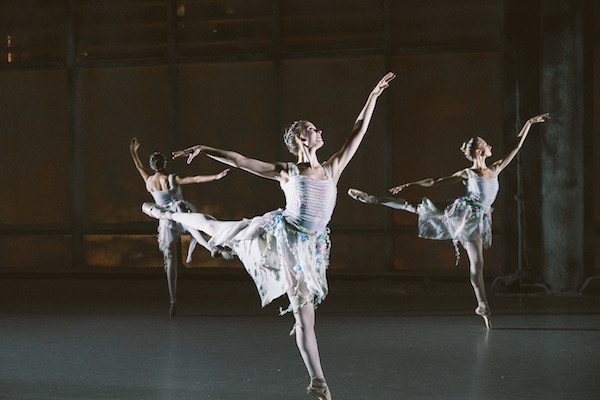 Three dancers in arabesque in The Nutcracker