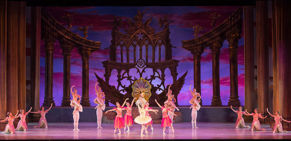 A stage full of dancers bow in The Nutcracker