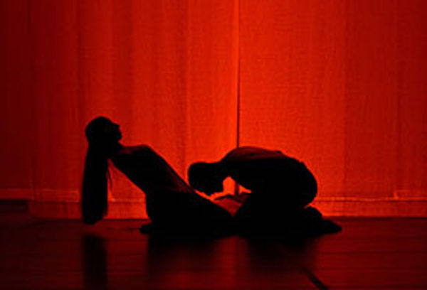 Two figures in shadow