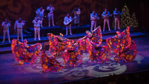 A group of Mexican folkloric dancers in full skirts