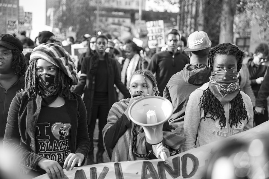 three Black women leading a protest