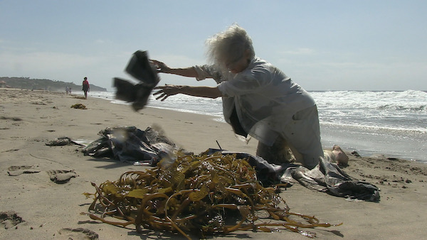 Simone Forti on the beach