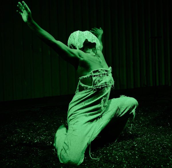 A figure in green light