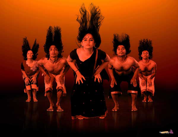 A group of dancers in red