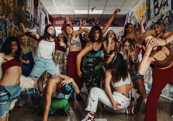 Dance students crowd a hallway