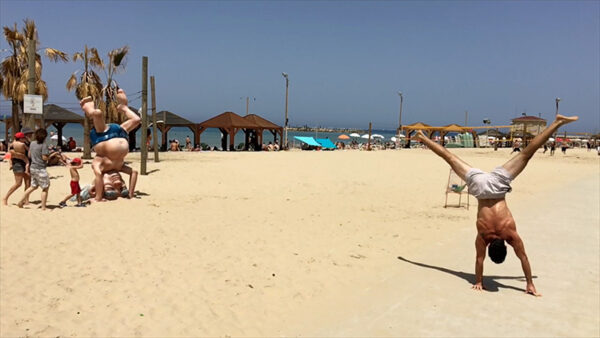 A man stanting on his hands