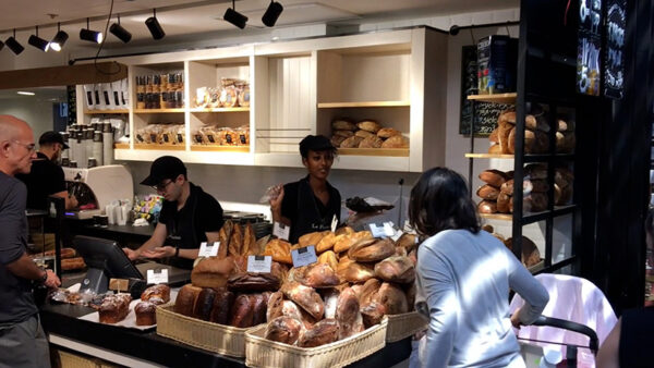 People shopping for bread