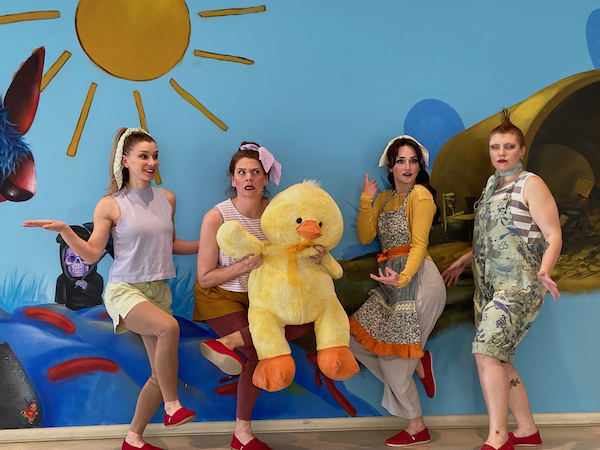 A group of dancers in old fashioned beachwear