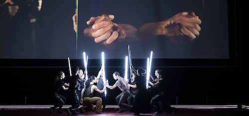 Dancers with lighted tubes