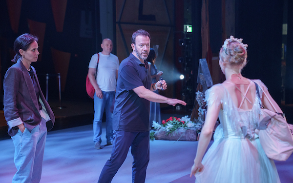 A man rehearses a dancer