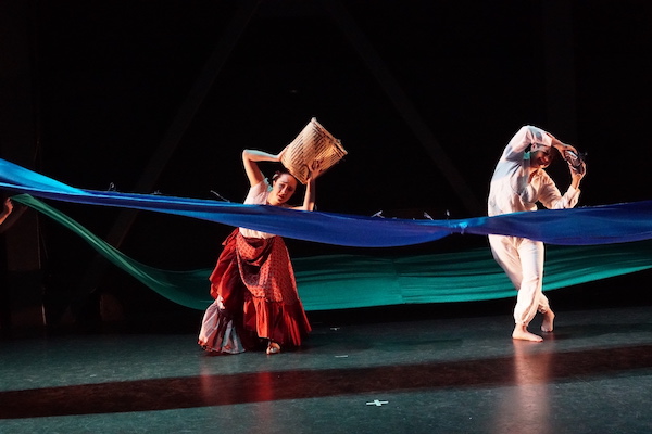 Folkloric dancers with long blue scarves
