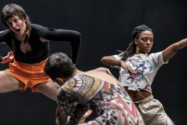 Three dancers in different positions