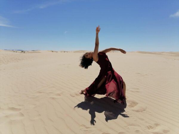 A dancer in the sand