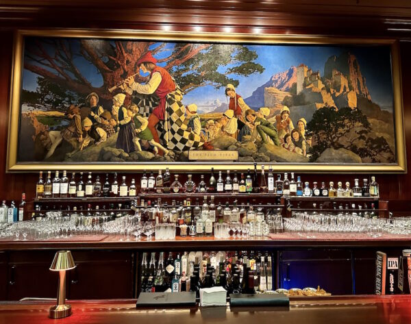 The Maxfield Parrish painting hanging above the bar.