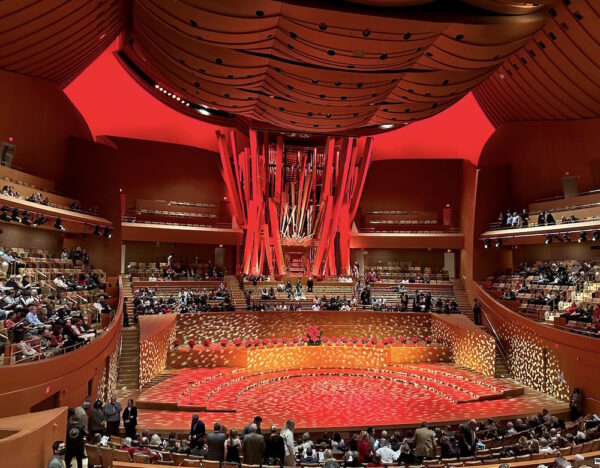 The interior of Walt Disney Concert Hall bathed in red light
