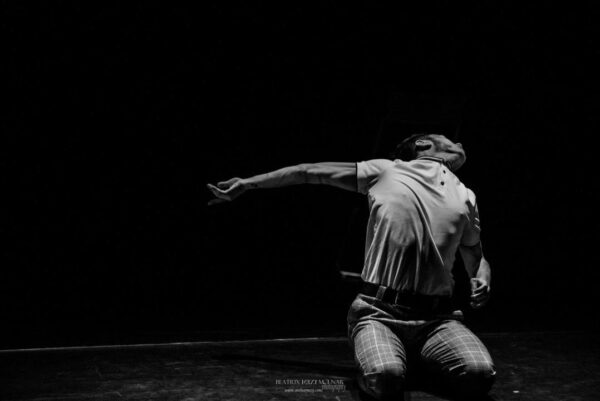 A dancer bends backwards