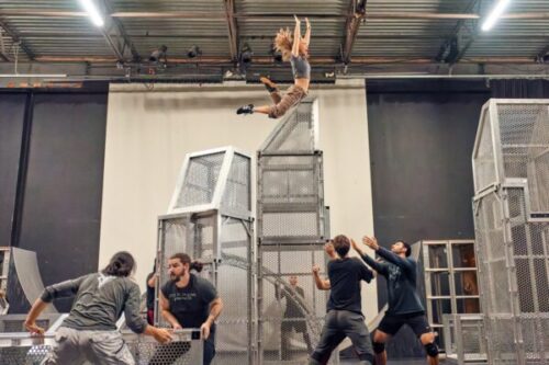 Dancer jumps from metal tower