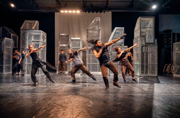 Dancers in front of towers