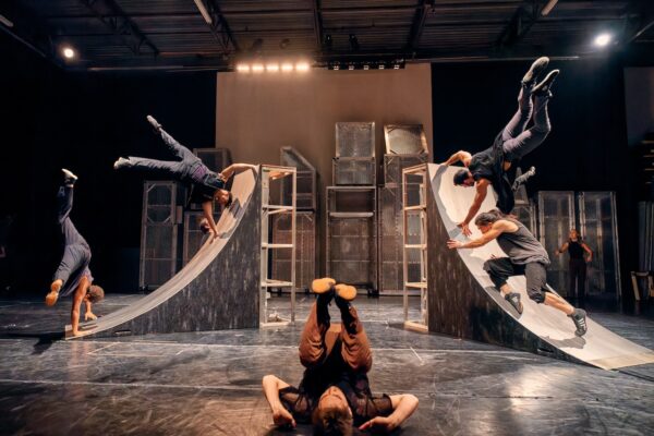 Dancers on two slides in Existencia