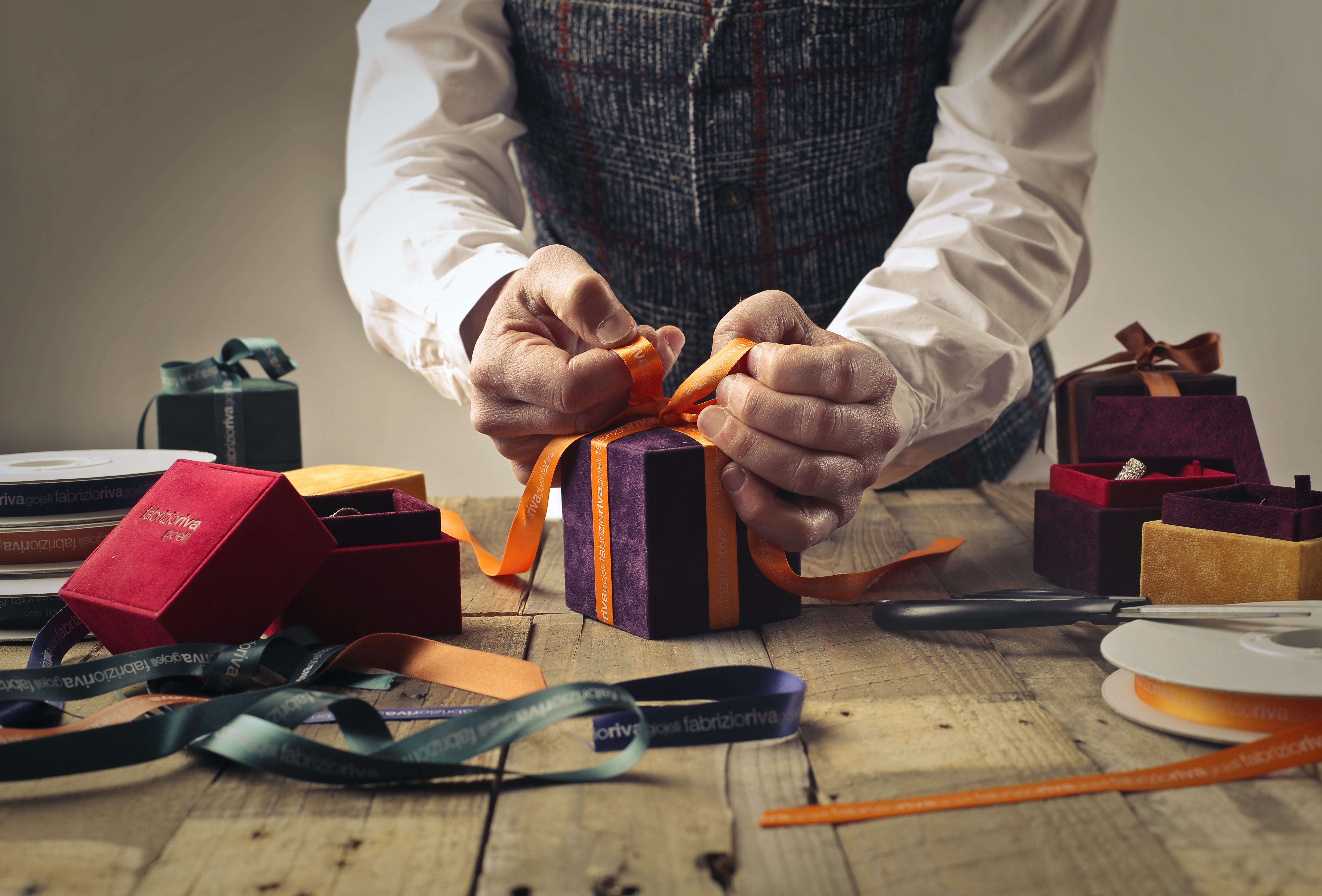 man wrapping gift