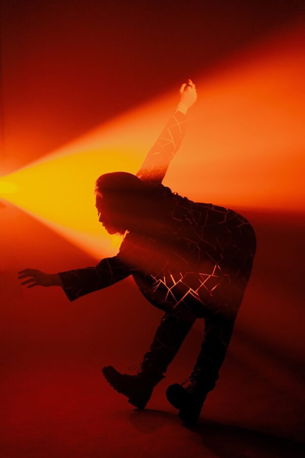 A dancer backlit