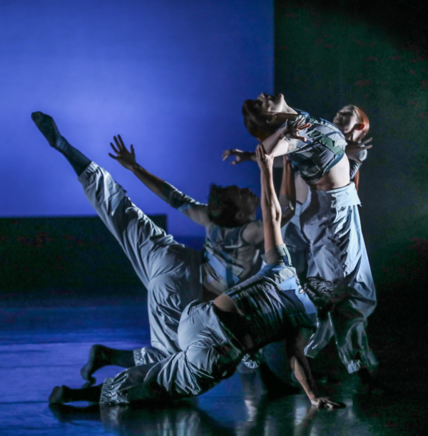 Dancers against a blue background