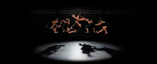 Dancers jump in the air