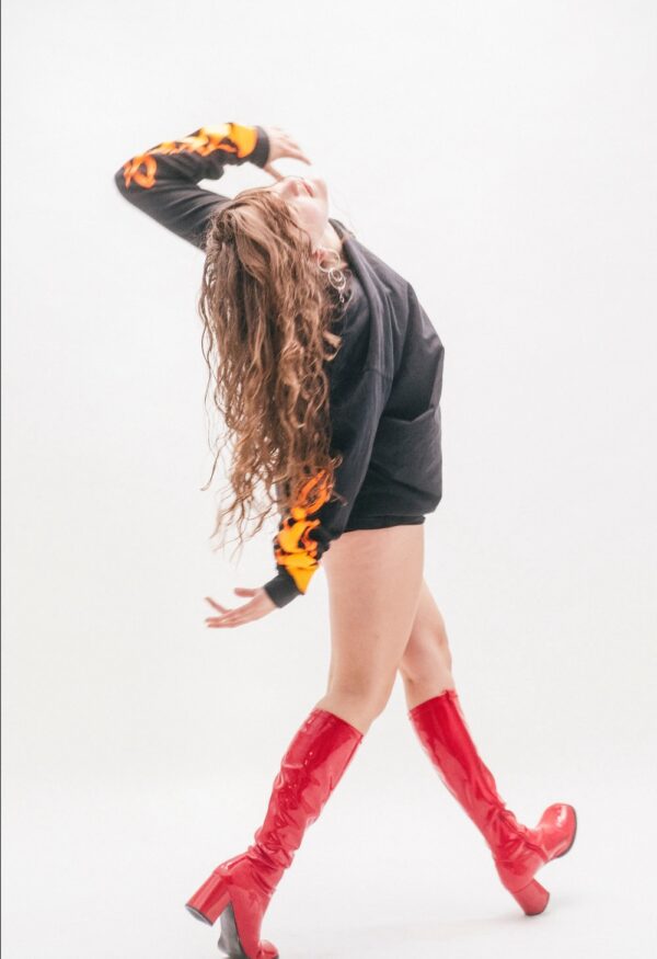 A dancer in red boots