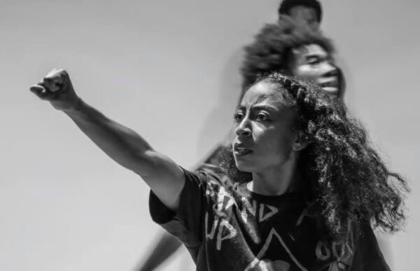 A woman extends her fist