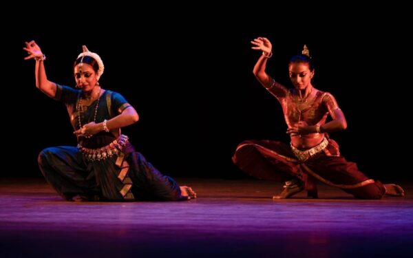 Two dancers in South Asian pose