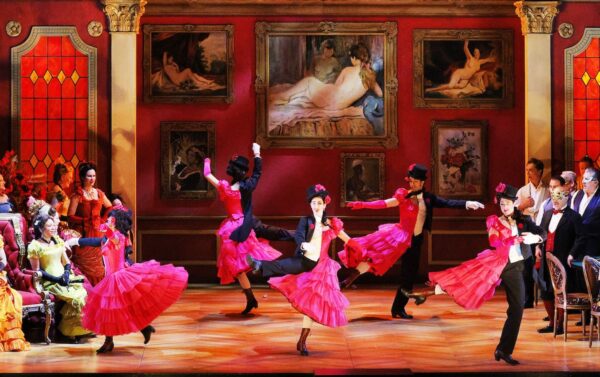 Dancers in half-male, half female costumes