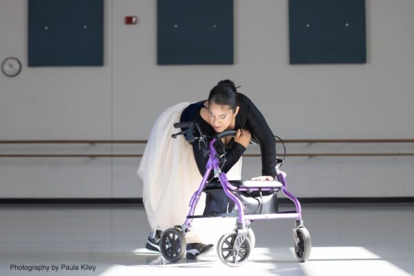 Dancer in purple with walker