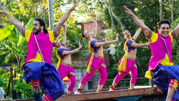 Dancers in pink strike a pose